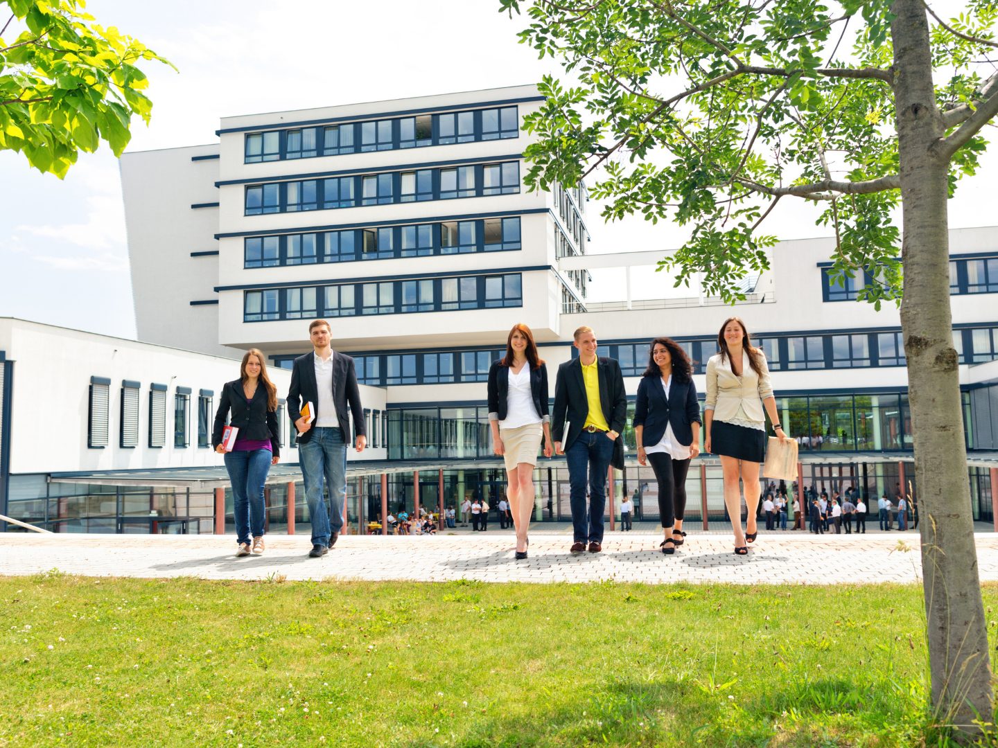 A group of students leaving a campus building
