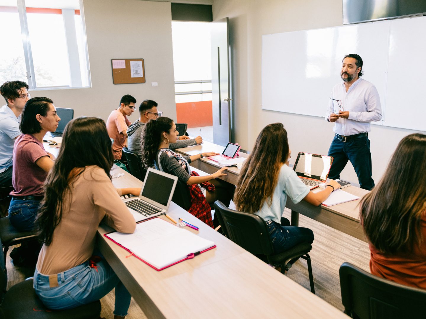 A classroom in session with a presenter at the front